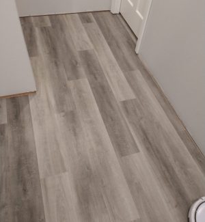 Gray hallway flooring install - KCD Handyman Services, LLC, - Services: Brandon, Seffner, Thonotosassa, Palm River, Mango, Plant City, Dover, Valrico, Fish Hawk, South Tampa, Apollo Beach, Riverview, Turkey Creek, Temple Terrace FL